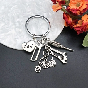 Détails du porte-clés papa argenté avec pendentifs outils et petite moto miniature