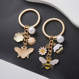 Set porte-clés abeille dorée avec breloques marguerites et perles blanches pour femmes