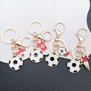Miniature football keychain set with soccer ball, jersey and gold plated charms for sports fans
