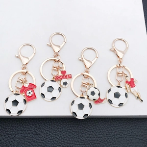Detail showing soccer themed keychains including shoe, jersey, and athlete pendants