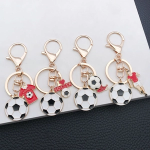 Detail view of soccer-themed keychains featuring football jerseys and sports charms