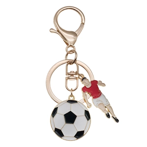 Mini soccer pendant keychain with athlete figure and rose gold clasp for sports fans