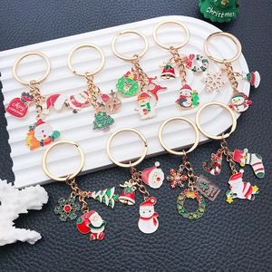 Christmas alloy keychain set featuring Santa, Reindeer, and Tree charms in festive colors