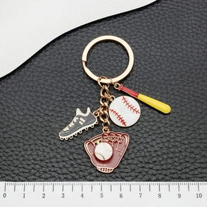 Baseball keychain with golden metal ring featuring colorful bat, ball, glove, and sneaker