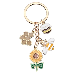 Golden sunflower bee keychain with honeycomb and honey jar charms for bag accessories