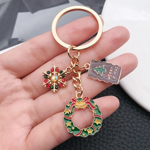 Porte-clés de Noël avec flocon, couronne et pendentif Merry X-mas doré