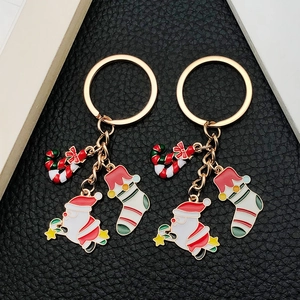 Enamel Christmas keychain set with Santa Claus, stocking and candy cane charms on gold ring