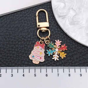 Christmas keychain with pink tree and snowflake charm on gold lobster clasp