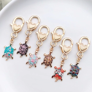 Set of 6 cute turtle keychains with colorful printed shells and heart lobster clasps