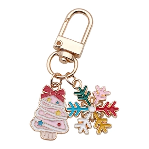 Pink Christmas tree keychain with colorful snowflake charms and gold lobster clasp