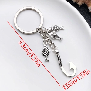 Detailed size view of an antique silver fishhook keychain with three fish charms