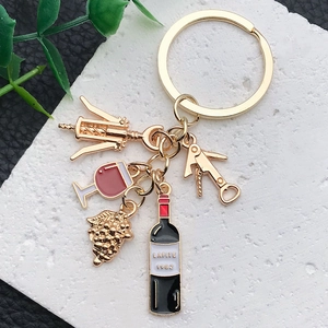 Golden wine theme keychain with Lafite bottle, wine glass and grape cluster charms