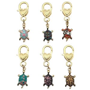 Set of 6 cute turtle pendants with heart-shaped lobster clasps in various colorful patterns