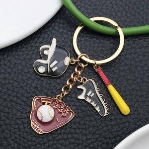 Cartoon baseball theme keychain with glove bat and helmet charms in gold finish
