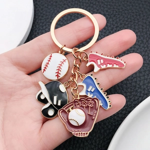 Rose gold baseball keychain featuring colorful enamel charms with sports-themed elements