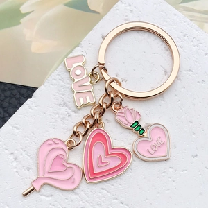 Pink heart and rose charm keychain with gold finish for a sweet romantic style