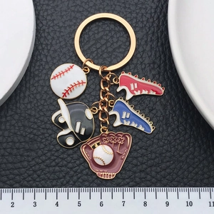 Baseball themed keychain with mini metal glove helmet and sneakers charms in red and blue