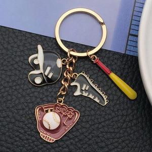Detailed view of baseball themed keychain with glove, bat, helmet and sneaker charms