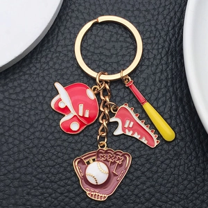 Detail of creative red sports keychain with baseball glove, shoe and helmet charms