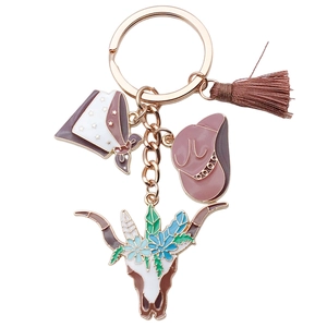 Western cowboy keychain featuring brown hat, floral bull skull, and stylish brown tassel
