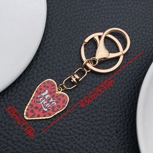 Detail view of heart-shaped keychain with Love You text and size dimensions displayed