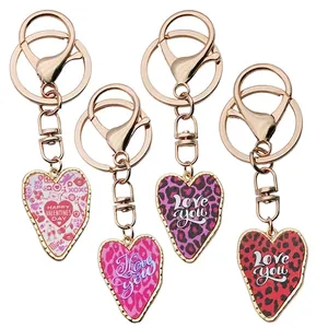 Golden alloy heart keychain with colorful leopard print and Valentine's Day designs