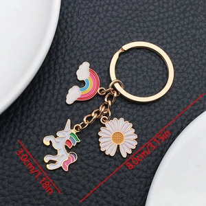 Detail view of cartoon unicorn and rainbow keychain with precise size measurements