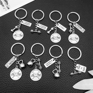 Fitness themed metal keychains with dumbbell barbell kettlebell and strength quotes