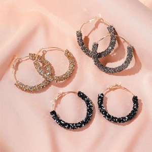 Detail view of heart alloy bangle set with sparkling rhinestones in three elegant finishes
