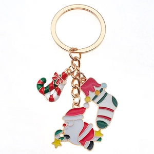 Porte-clés de Noël en métal doré avec figurines de Père Noël, chaussette et sucre d'orge