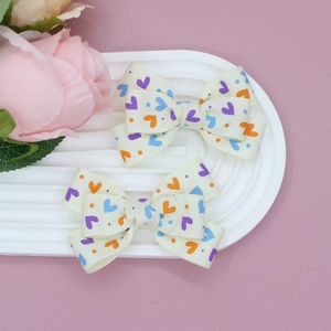 Lot de deux barrettes à nœuds avec imprimé cœurs pour filles, style doux Saint-Valentin