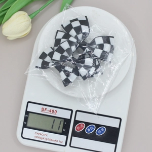Five-piece set of checkerboard pattern bow hair clips in classic black and white style
