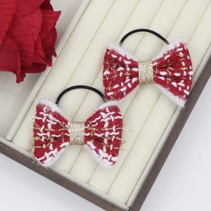 Détails de nœuds pour cheveux en tweed rouge et blanc avec fils dorés scintillants