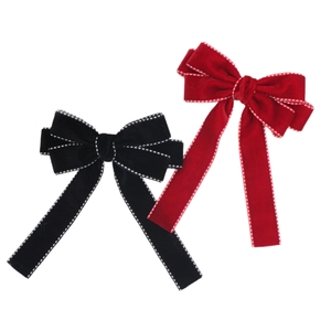 Elegant velvet bow hair clip with white dotted stitching and long pendant streamers