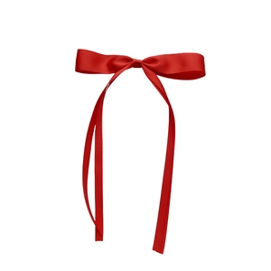 Detailed view of the bright red satin ribbon bow with long flowing streamers