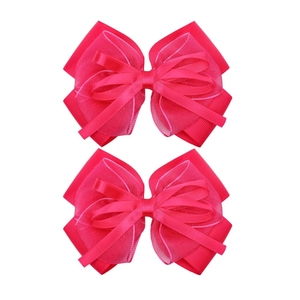 Detail view of double layered rose pink chiffon and satin bow clips for girls
