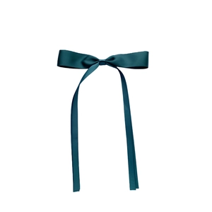 Detail of dark green satin bow hair clip with long ribbons on white background