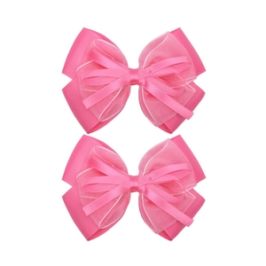 Detail of two-piece pink chiffon bow hair clips with textured layers and satin ribbon center