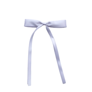 Close-up of white satin ribbon bow with long tails on a clean white background