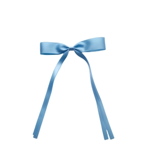 Detail of light blue satin ribbon bow hair clip with long flowing streamers
