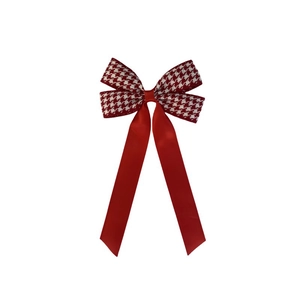 Detail view of red and white houndstooth ribbon hair clip with smooth satin finish