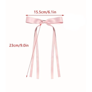 Pink satin ribbon bow hair clip for girls with long streamers and detailed size specifications