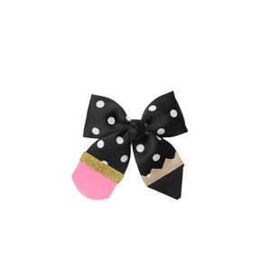 Detail of pencil-themed hair bow made with polka dot grosgrain ribbon and pink eraser part