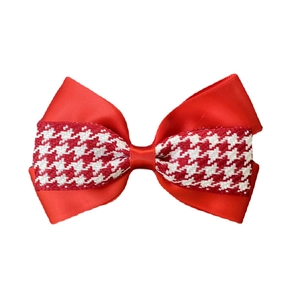 Detail of double-layer houndstooth and red satin ribbon bow hair clip for girls