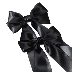 Elegant pair of black satin bow hair clips with long streamers for girls