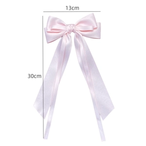 Pink satin ribbon bow hair clip with long streamers and dimensions of 13x30 cm