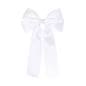 Close-up of white satin bow hair clip featuring elegant long ribbons and silky texture