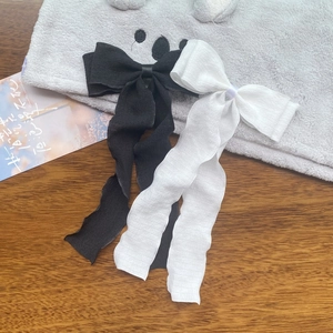 Elegant set of black and white pleated ribbon bow hair clips for women with long streamers