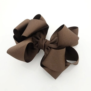 Detailed view of the layered dark brown grosgrain ribbon bow with fine ribbed texture