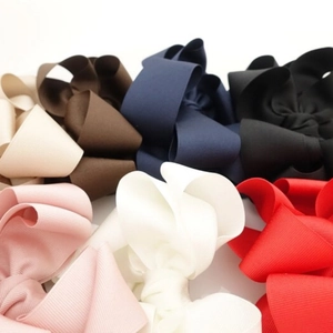 Multi-layered ribbed ribbon bow hair clips in various colors for girls and women
